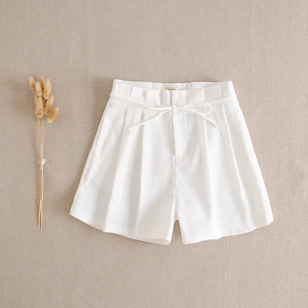 CONJUNTO DE CHICA BLUSA DE RAYAS EN TONOS CORAL Y SHORT BLANCO