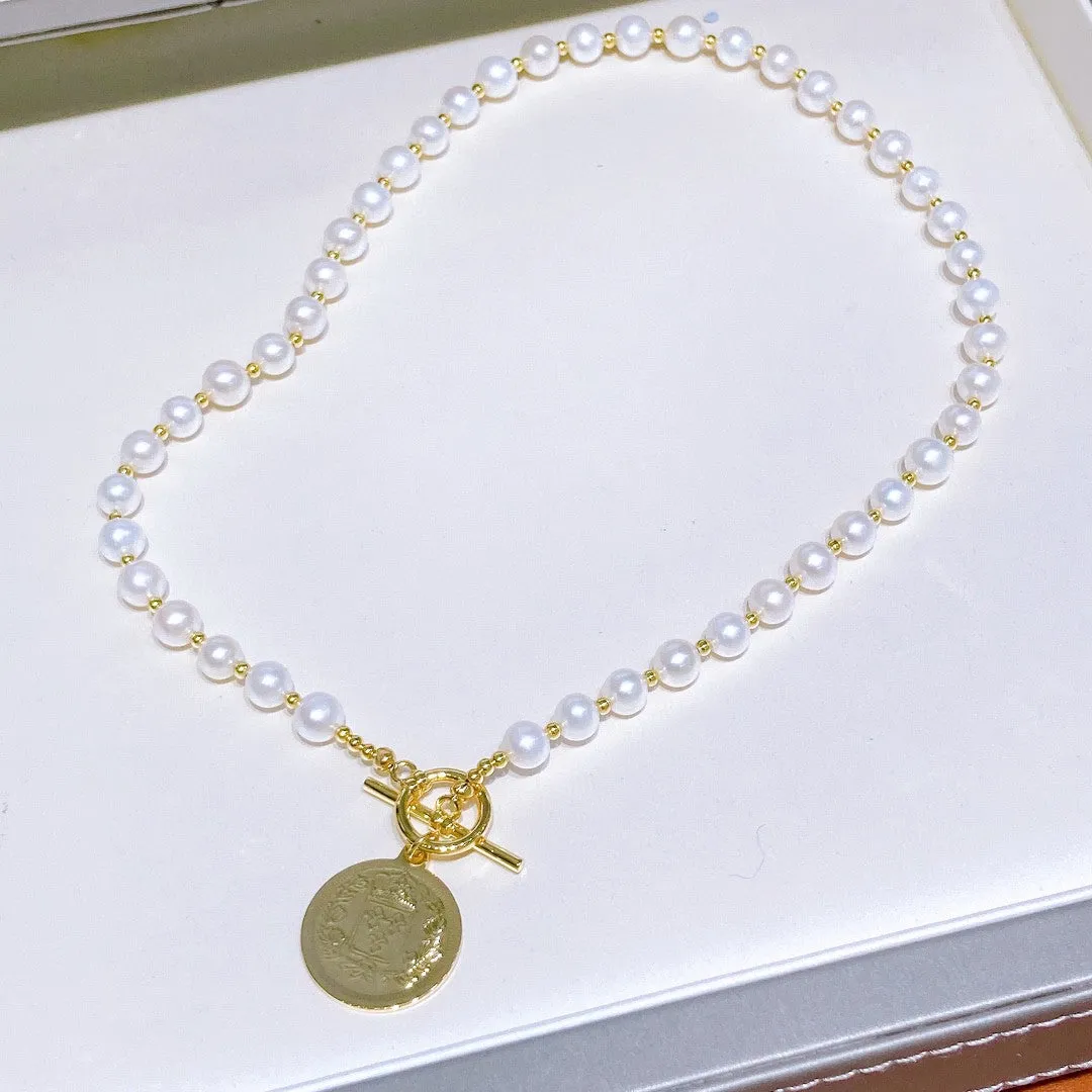Natural pearl necklace with gold coin pendant
