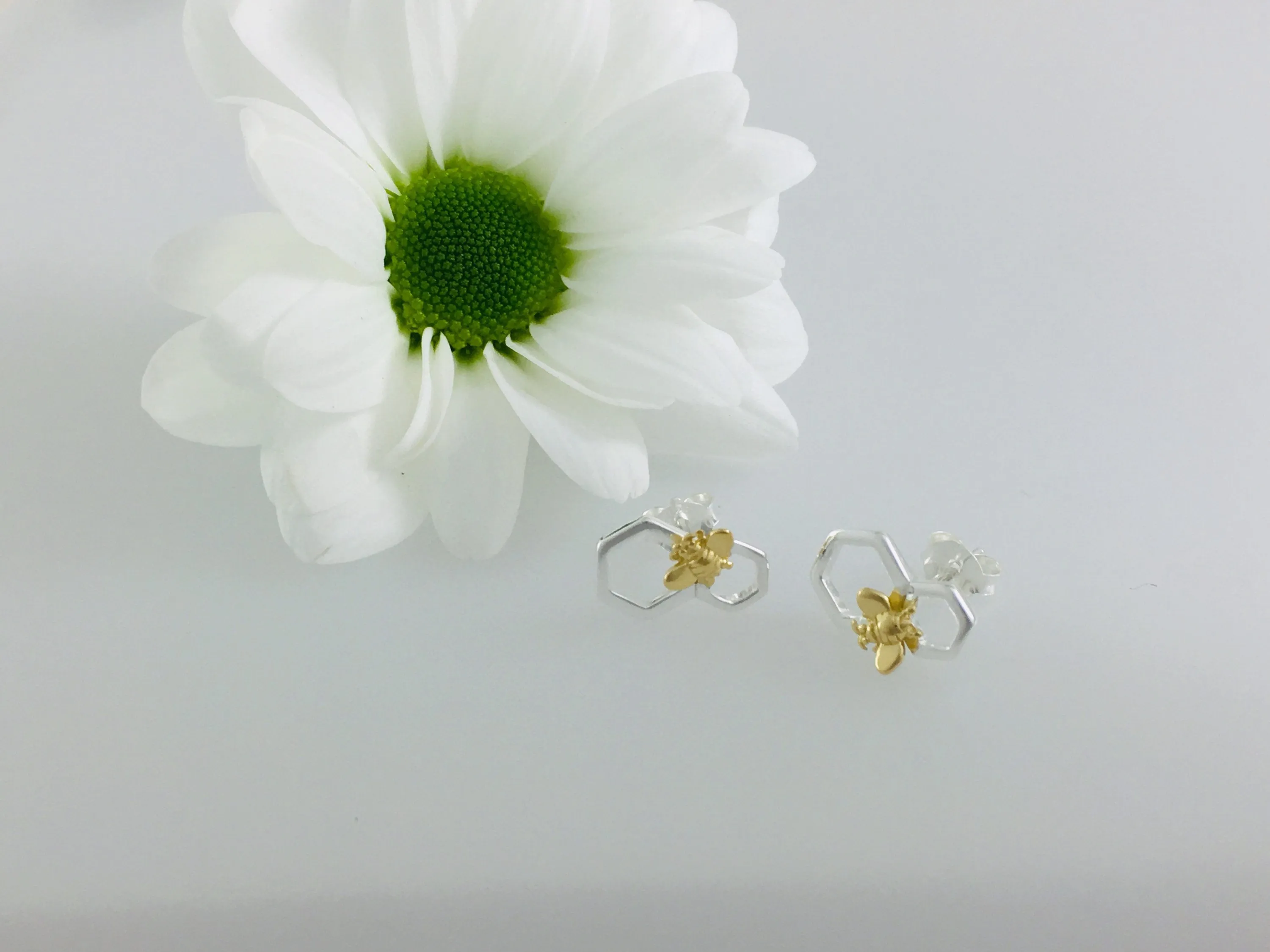 Silver Honeycomb Bee earring studs.
